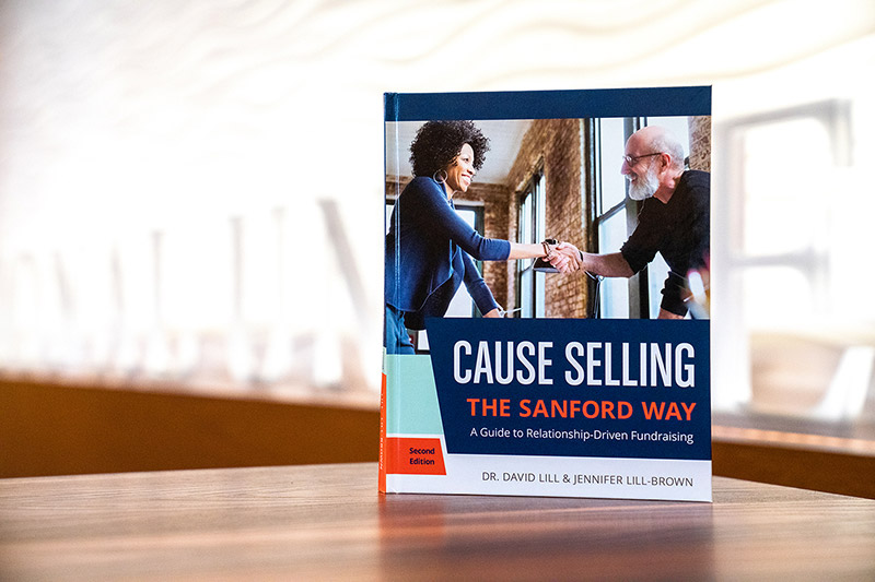 Cause Selling book displayed on a table